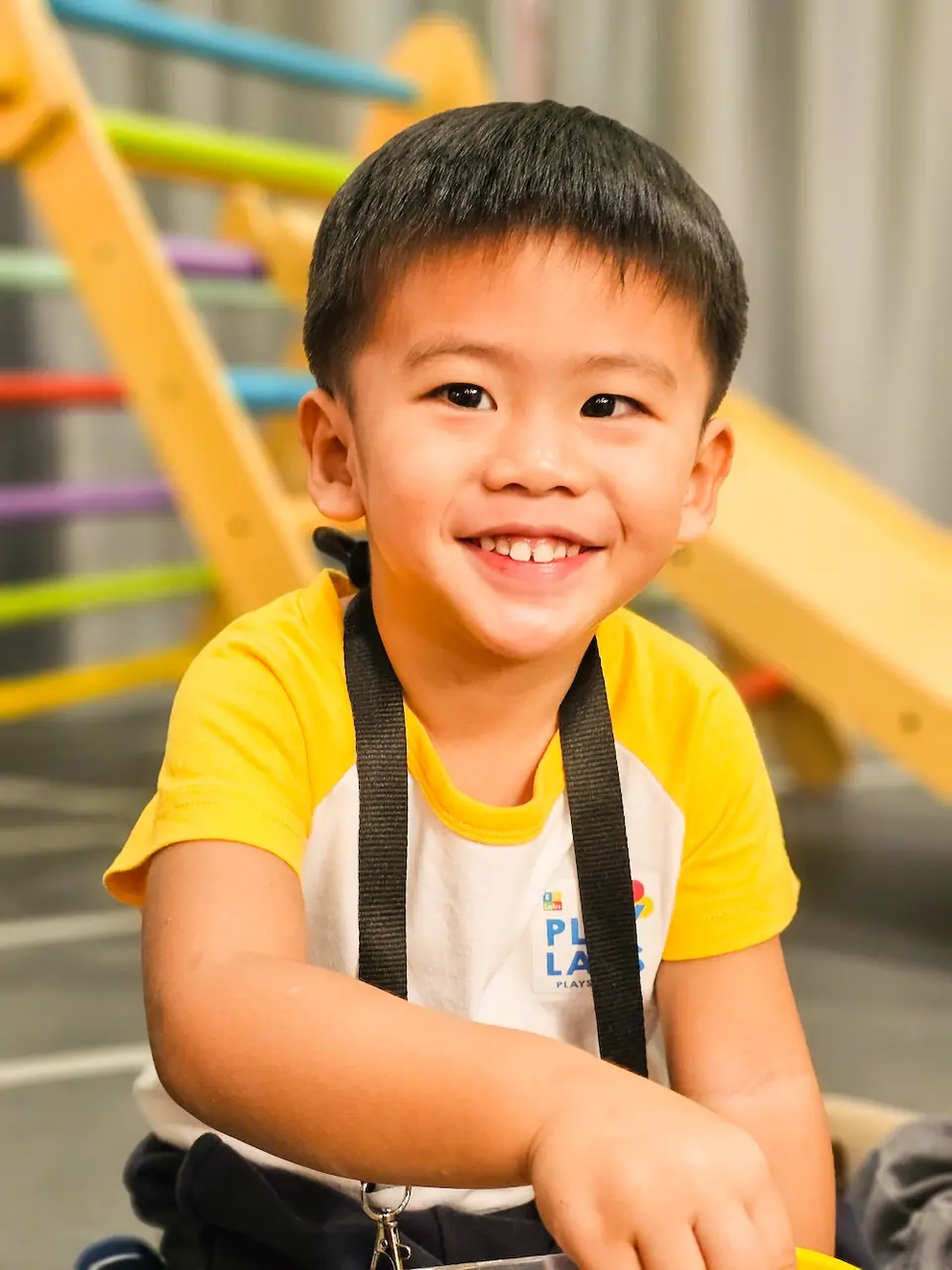Smiling boy in an ELLabs shirt