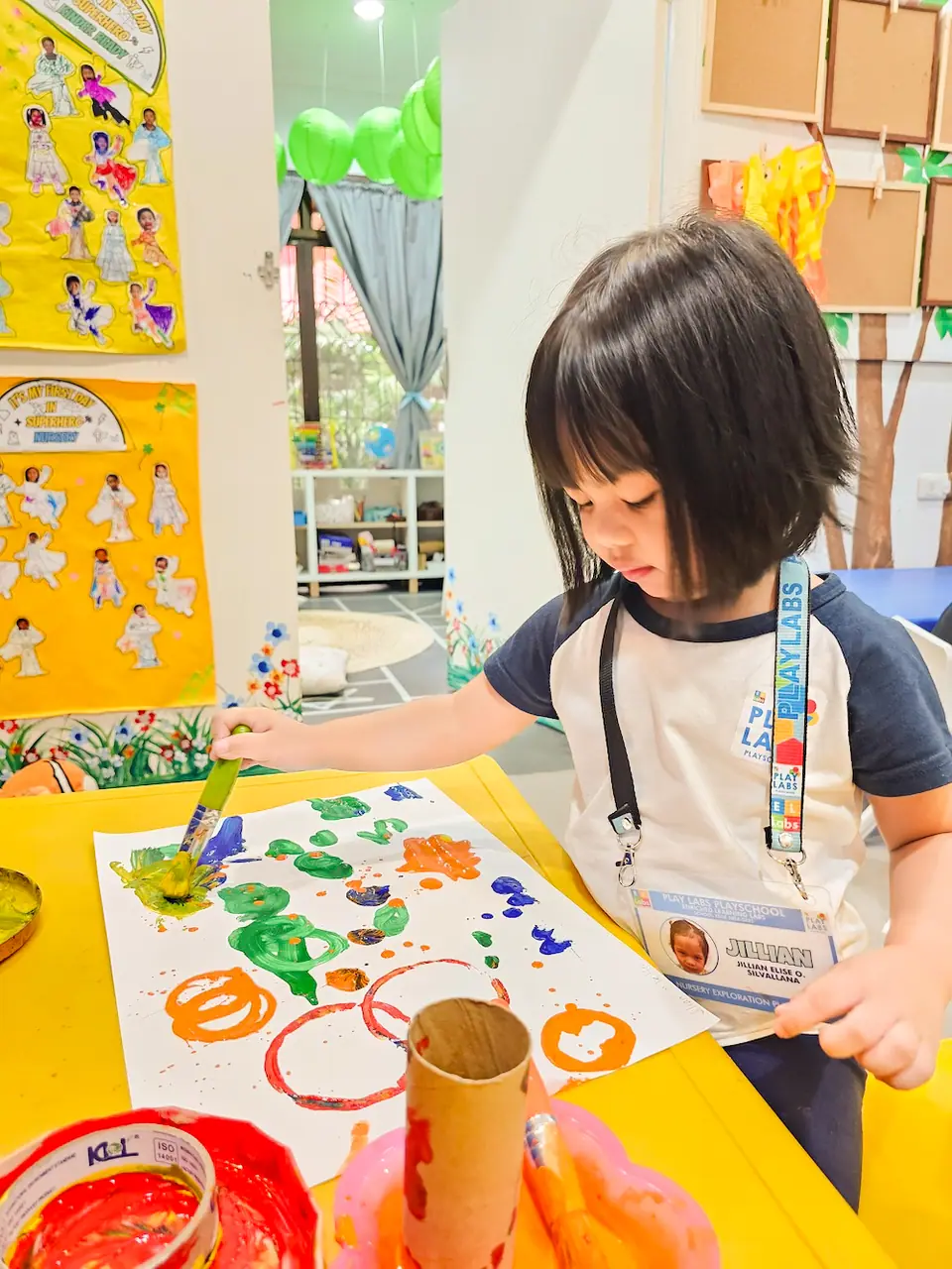 Child painting at Enriched Learning Labs