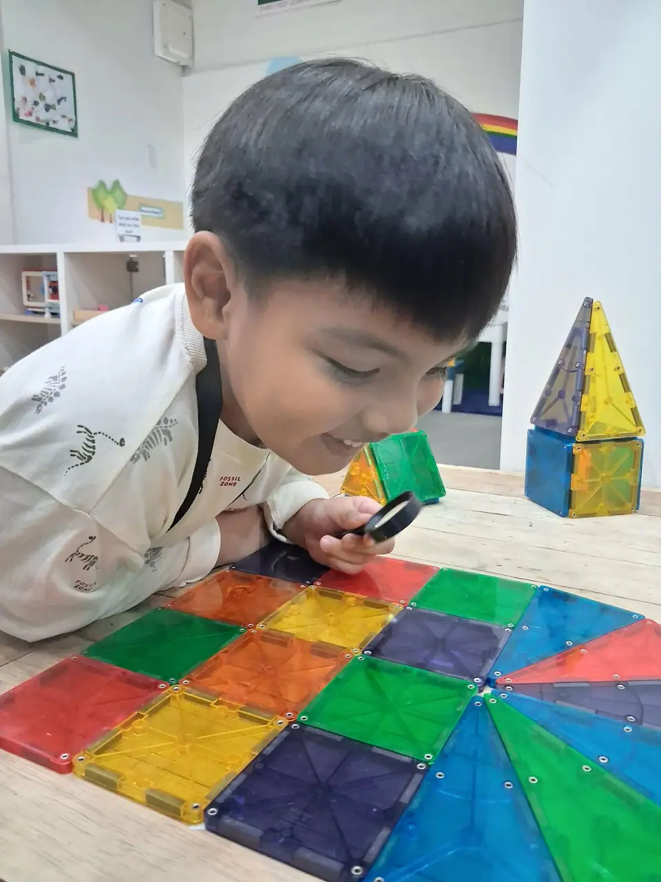 Child exploring colorful building materials