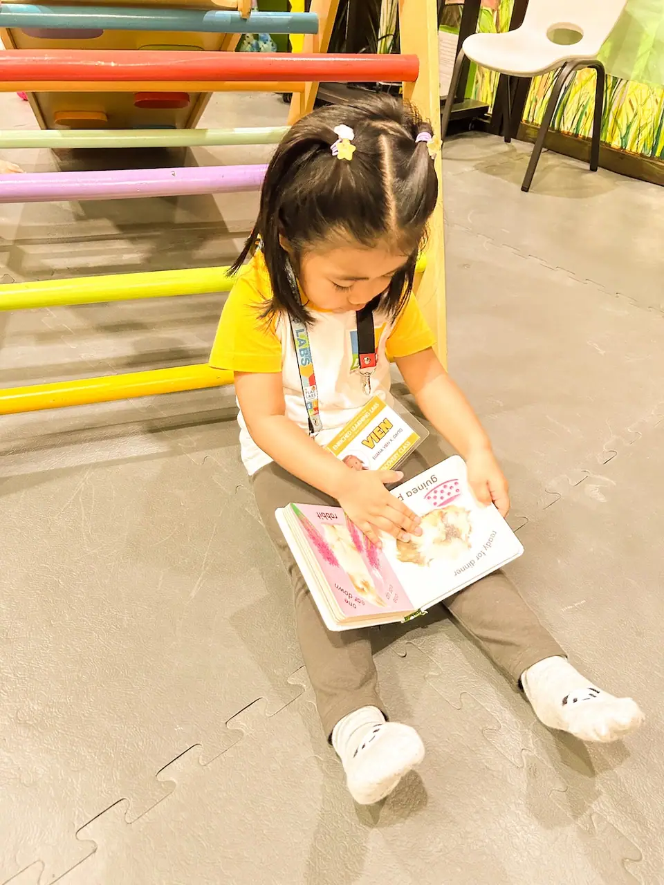 Child reading at Enriched Learning Labs